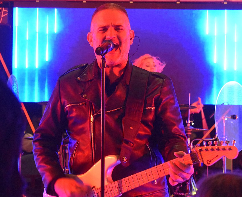 Matt Simmons, guitarist for No Filter, performs for the New Year's Eve celebration at Waterside Place.
