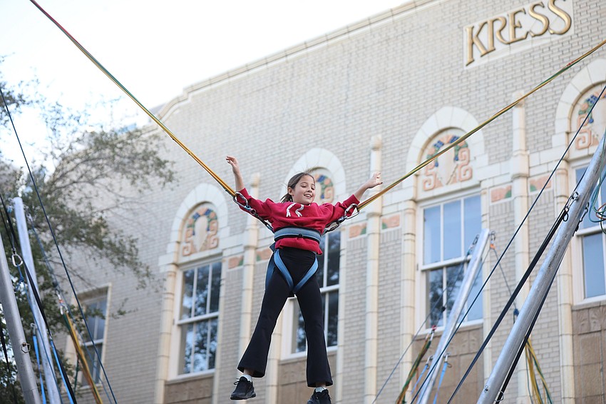 The 94-year-old S&H Kress and Co. building serves as a backdrop for 11- year-old bungee jumper Jenna King from Baltimore.