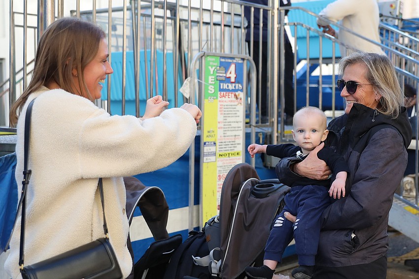 All the way from Illinois are Cassie Blair and 9-month-old Cole, who are visiting mom, Joan, from Tampa.