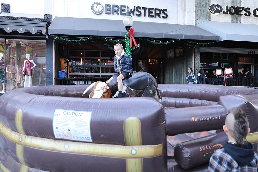 Finn O'Dell from Indiana takes a ride on the mechanical bull.