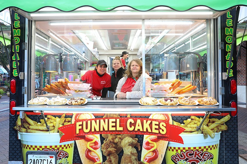 Bay City Concessions delivers the goods with Mitra Sartipi, Tanya Turner and Cindy Broadhead who note the regular and cinnamon funnel cakes are the most popular.