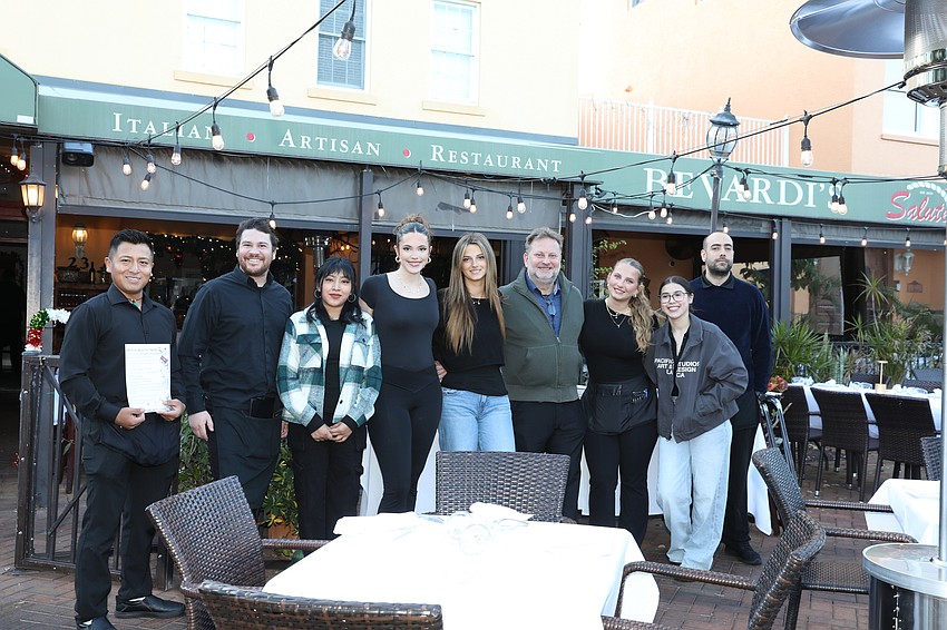 Owner Laszlo Bevardi (fourth from right) and his staff are ready for their guests who have booked all time slots.