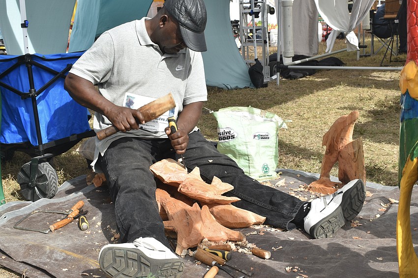 Artist Ranford Baker created wood carvings on site.