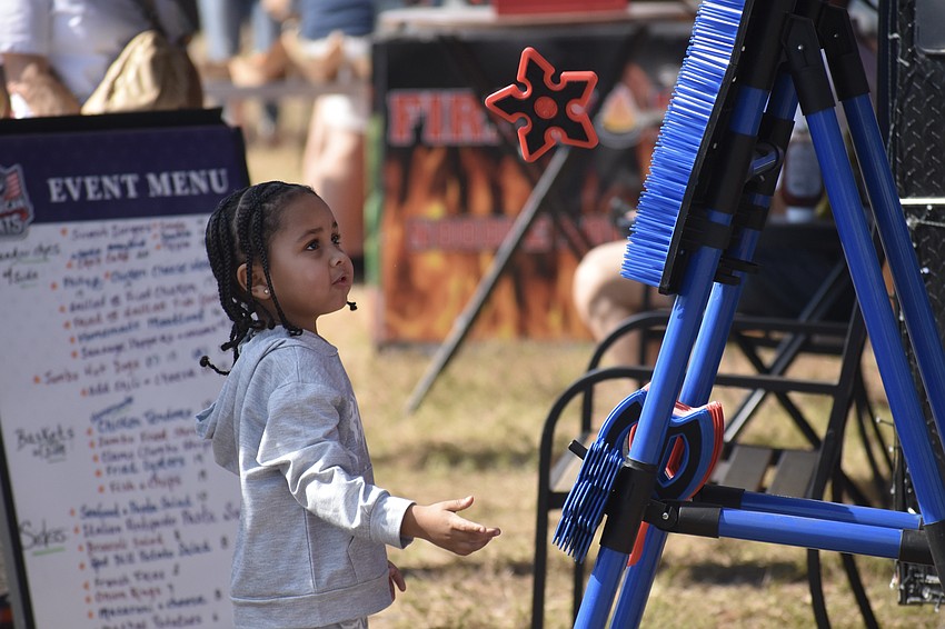 Chosen Elliott, 4, aims for the target.