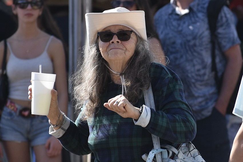 Beverly McMillin dances to the music.