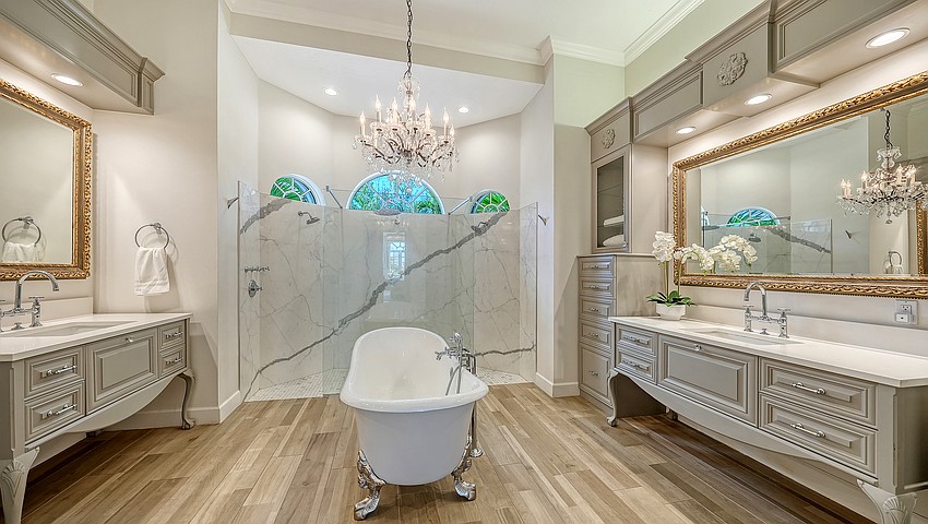 Of the eight bathrooms, three are ensuite. The primary bath’s vibe is one of a spa.