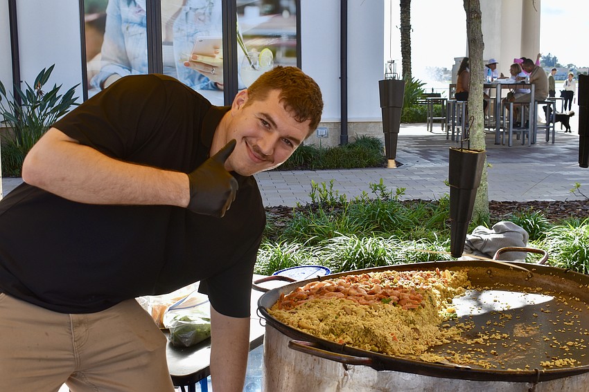 Vince Martinez is Chef Ef Martinez's nephew. He says that giant pan of paella is typically all gone by the end of each farmers' market.