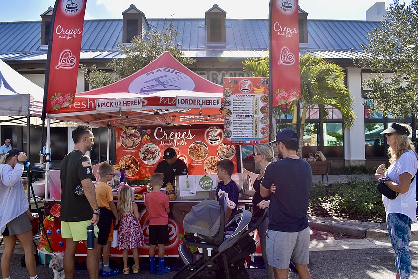The Magic Crepes tent attracts a steady crowd throughout the morning and afternoon.