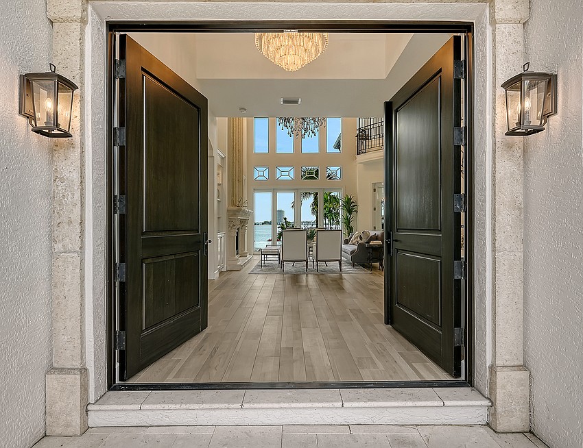 A pair of Sapele entry doors welcome visitors to 1418 Ringling Parkway.