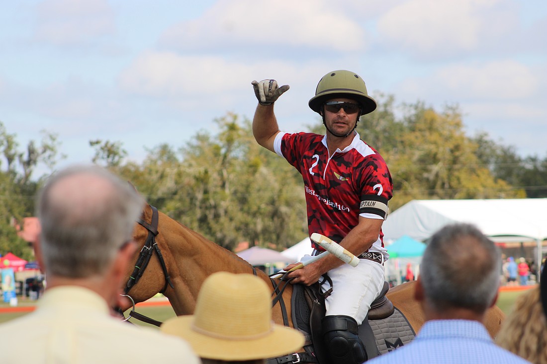 Southside Polo's Mason Wroe talks to fans about the basics of his sport in a short clinic before the Jan. 4 match.