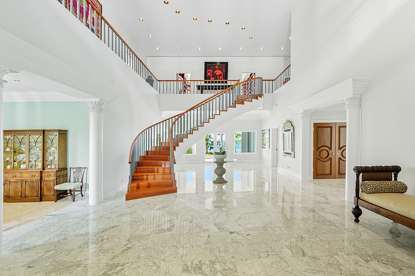 A grand foyer greets guests at 3315 Bay Shore Road.