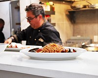 A steaming plate of pasta comes up to the pass while Simone Salustri, owner of the newly reopened Nōnnō Umberto restaurant, begins work on another dish.
