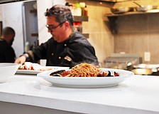 A steaming plate of pasta comes up to the pass while Simone Salustri, owner of the newly reopened Nōnnō Umberto restaurant, begins work on another dish.