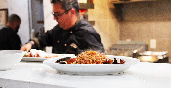 A steaming plate of pasta comes up to the pass while Simone Salustri, owner of the newly reopened Nōnnō Umberto restaurant, begins work on another dish.