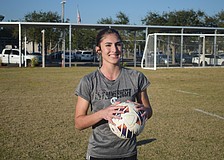 Bronwyn Leggett poses for a photo before a Jan. 5 practice at Riverview High School. She's deep into her second season as the full-time starter between the posts for the Rams.