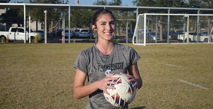 Bronwyn Leggett poses for a photo before a Jan. 5 practice at Riverview High School. She's deep into her second season as the full-time starter between the posts for the Rams.
