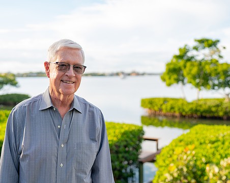 Nick Gladding poses for a photo in his Sarasota Bay-facing backyard Friday, Jan. 2. In March, Gladding will be sworn in as the next Longboat Key District 3 Commissioner.