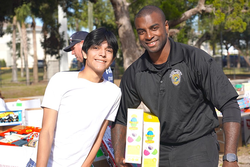 Sarasota Police Department Recruit Officer Eric Coley was among the SPD personnel handing out gifts at the SPD's Three Kings Day event. Sarasota Police Department Recruit Officer Eric Coley was among the SPD personnel handing out gifts at the SPD's Three Kings Day event.