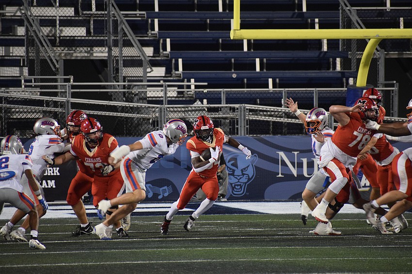 Running back Connail Jackson (center) finds a gap during the 2025 FHSAA Class 2A state championship between Cardinal Mooney and Bolles. The Cougars enter 2026 looking to reload for another title.