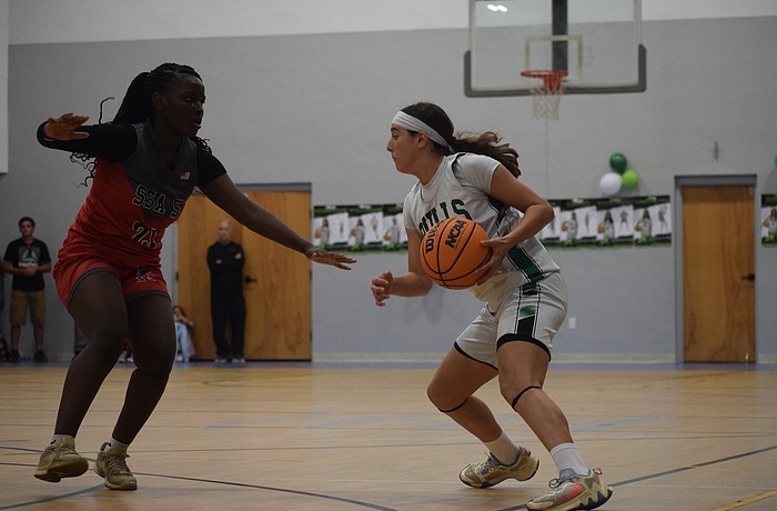 Eva Lopes operates around the 3-point line during the Florida Suncoast League championship on Dec. 18 at the Sarasota Baptist Church gym. She powered Sarasota Suncoast Academy past Sarasota School of Arts and Sciences with a game-high 21 points.
