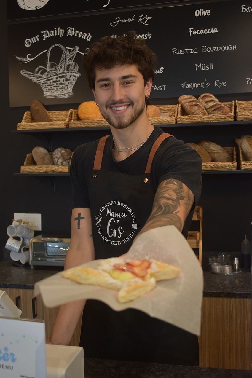 Blair Sellers, one of the owners at Mama G's UTC, offers a strawberry cheese danish.
