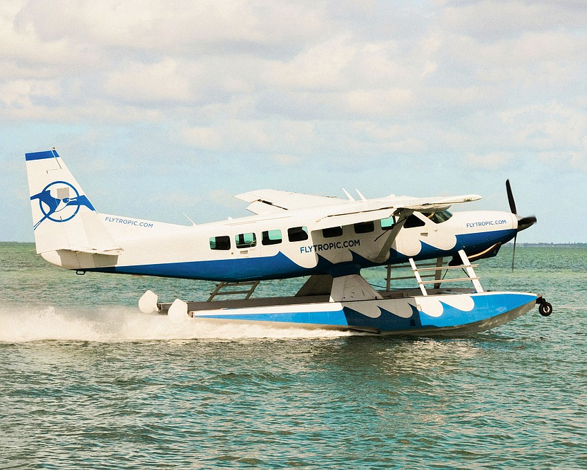 A Tropic Ocean Airways pontoon plane lands on Sarasota Bay. The airline and St. Regis Longboat Key Resort are partnering to provide a one-of-a-kind travel experience, dropping guests off near Ken Thompson Park before they are boated to shored and receive a ride in a Bentley to the resort. A Tropic Ocean Airways pontoon plane lands on Sarasota Bay. The airline and St. Regis Longboat Key Resort are partnering to provide a one-of-a-kind travel experience, dropping guests off near Ken Thompson Park before they are boated to shored and receive a ride in a Bentley to the resort.