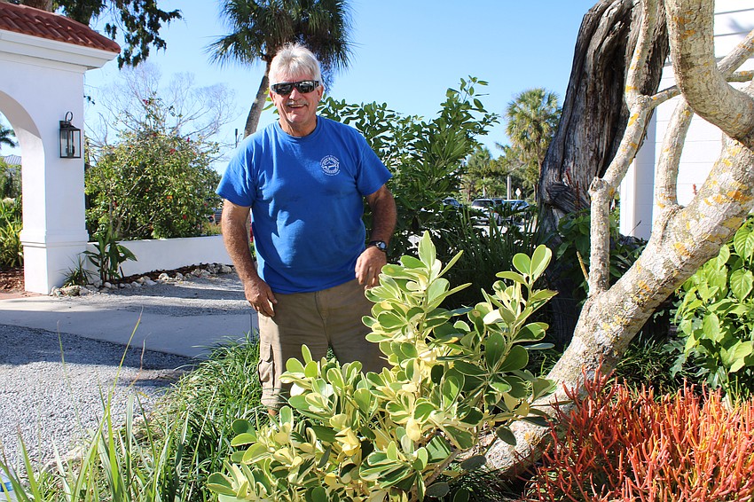 Jack Joyce lends a hand with planting new additions to the Friendship Garden.
