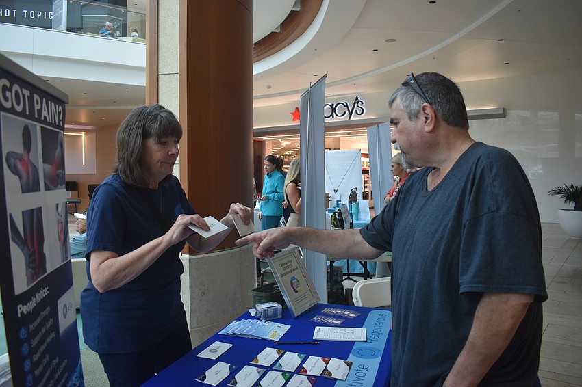 Lifewave brand partner Sharon Newson explains all about patches that are advertised to provide more energy, more endurance and a quicker recovery to Sarasota's Dan Sepulveda. Sepulveda didn't believe they would work to relieve pain, but after placing a patch on his back and one on his shoulder, he said the pain subsided within 15 minutes.