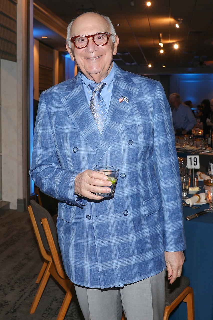 David Chaifetz is looking especially dapper in his brand new jacket, which matches the moody-blues ambiance of the ballroom.