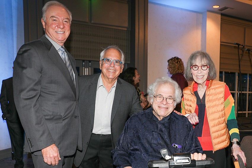 Paul Miller and this evening's auctioneer Michael Ritter with Itzhak and Toby Perlman.
