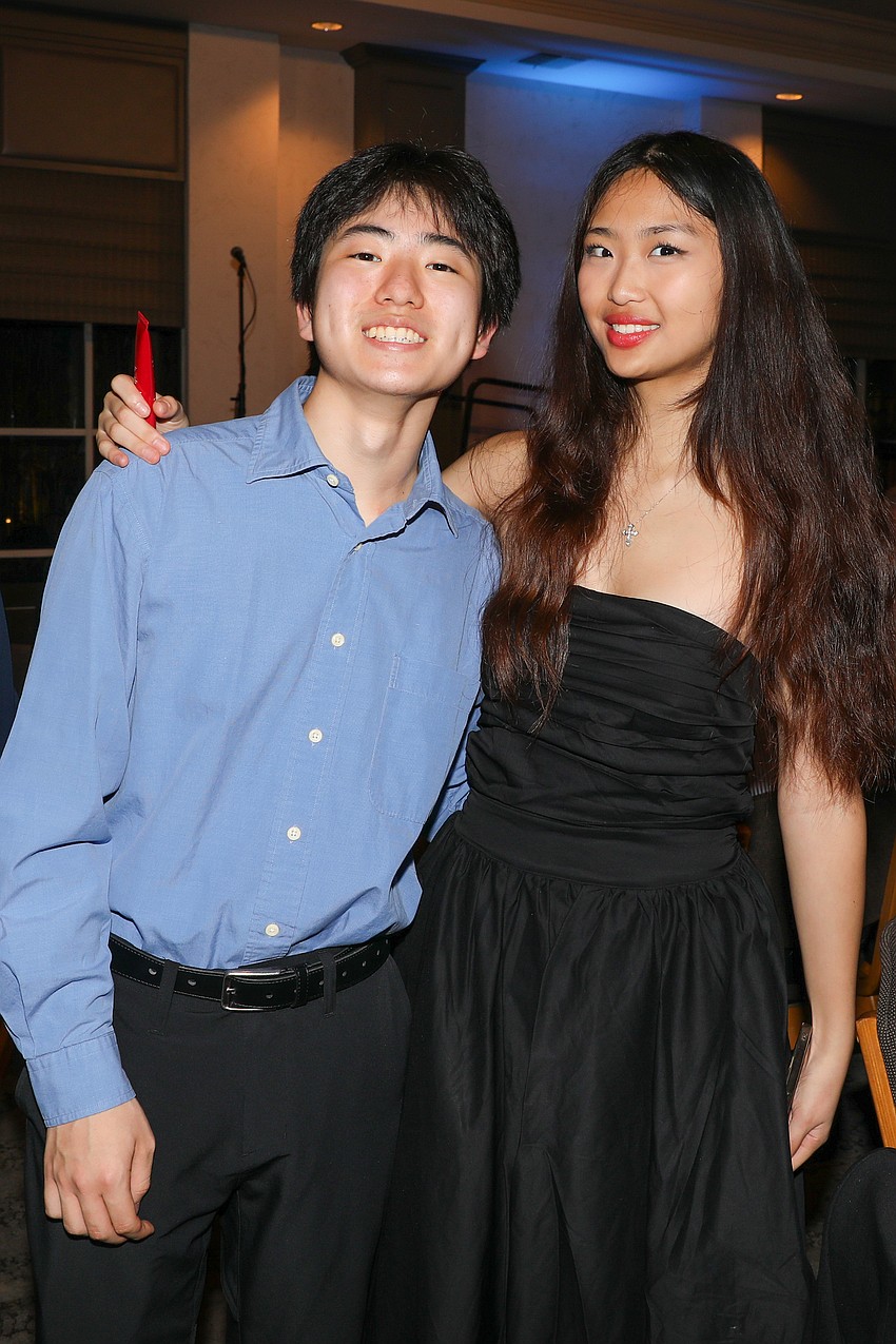 All the way from Philadelphia is Samuel Tatsuki, and he is photographed with Luli Gai, who flew in from Hong Kong.
