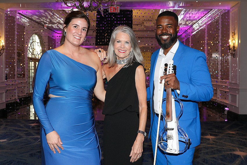 Rachel Williamson, Sally Schule and Laron Hearst are ready to greet over 650 guests.