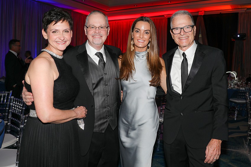 Kristin and Dr. Kyle Garner with Gina and Mike Rouen