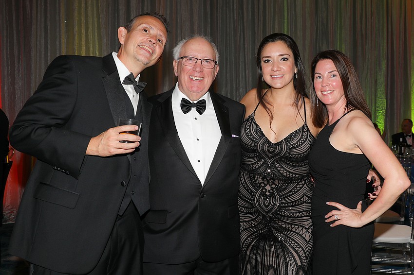 Dr. Ken Meredith and Dr. Rick Brown with Stephanie Wilder and Bree Meredith