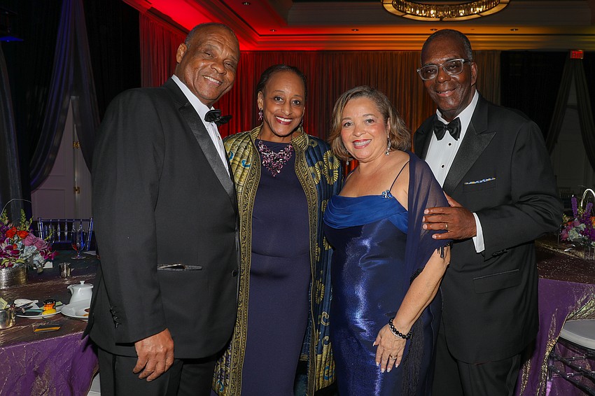 Dr. Francis Curd and his wife, Pam, with Irene and Ron Johnson