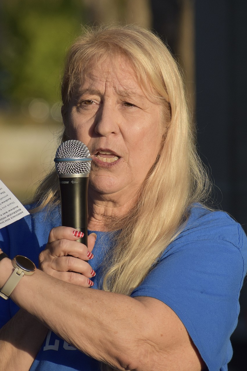 Stacey Monroe makes an announcement as the event begins.