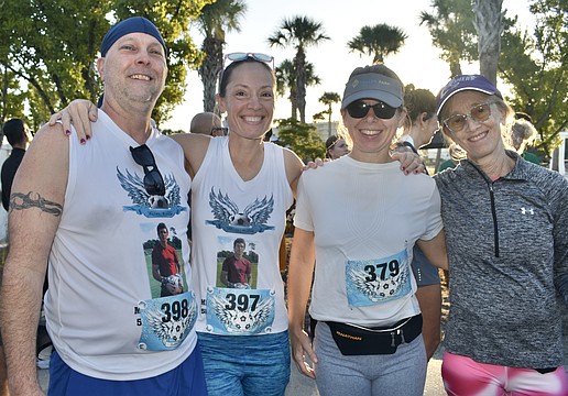 Mark Garland, Theresa Andrews, Ann Palmer and Denise Costa prepare for the race.