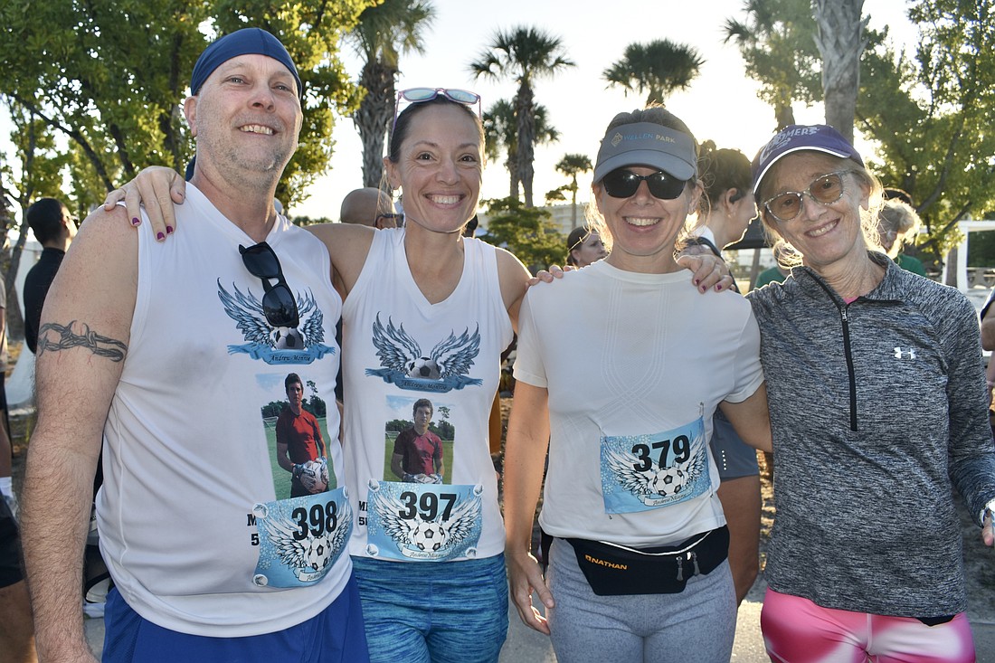 Mark Garland, Theresa Andrews, Ann Palmer and Denise Costa prepare for the race.