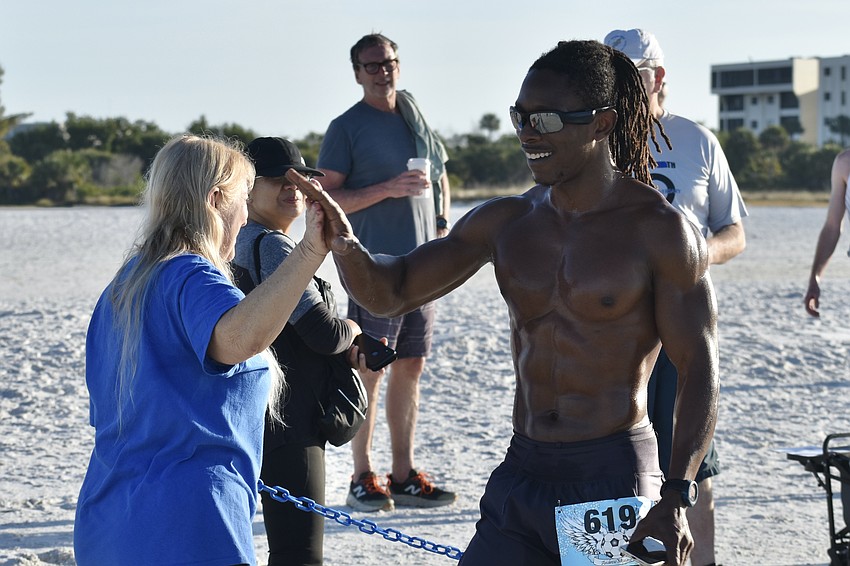 Stacey Monroe gives a high five to Alexander Wordsworth.