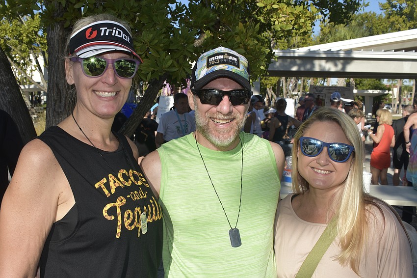 Runners Audrey Symowicz and Rob Ashodian, and volunteer Andrea Capek, enjoyed supporting the event.