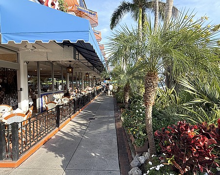 All appears back to normal in some areas of St. Armands Circle, such as the sidewalk and landscaping aside Columbia Restaurant. Many storefronts, however, remain vacant 15 months after Hurricane Milton.