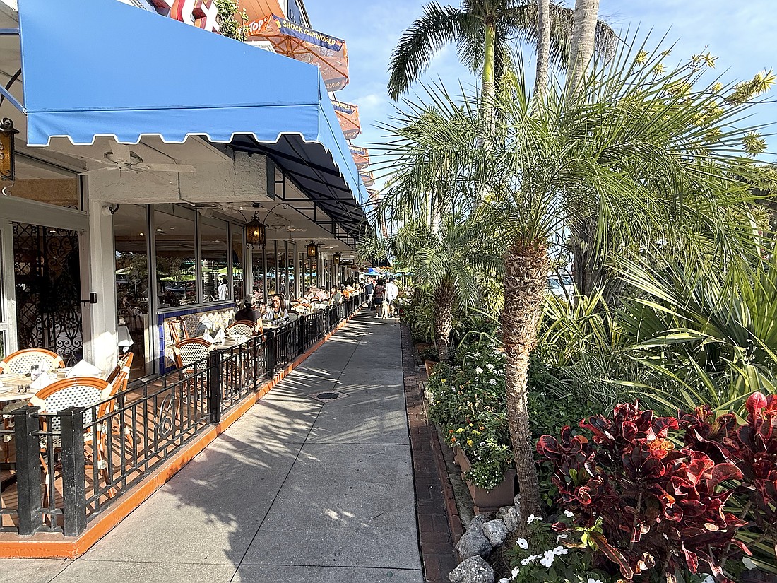 All appears back to normal in some areas of St. Armands Circle, such as the sidewalk and landscaping aside Columbia Restaurant. Many storefronts, however, remain vacant 15 months after Hurricane Milton.