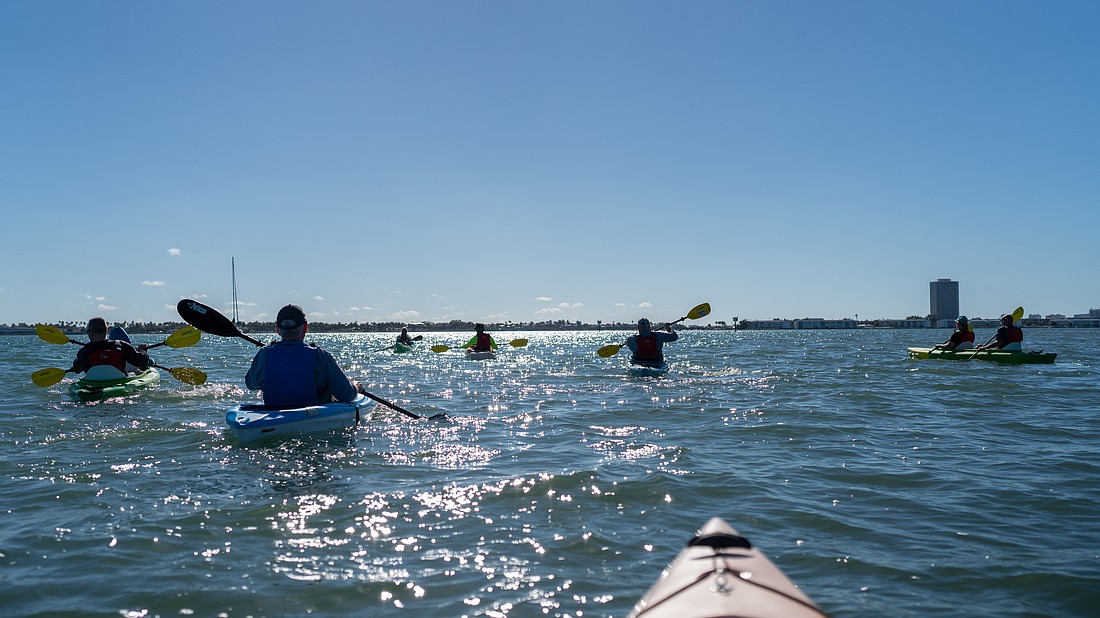 A group of 13 veterans and volunteers met at Ken Thompson Park on City Island where they embarked on kayaks for a guided tour of Sarasota Bay led by Wayne Douchkoff of Wayne Adventures and sponsored by Sarasota Bay Estuary Program.