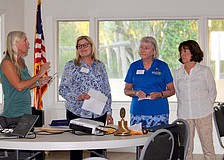 Rotary Club of Longboat Key President Terri Driver presents awards to members Ellen Greenberger, Carol Erker and Belinda Bauer for not only contributing their hours, but also offering financial support to the Rotary's mission over the years. Driver presented the awards at their Jan. 6 meeting, which featured guest speaker Charlie Mopps from Public Works.