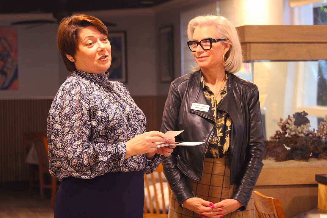 Tara Maffei, executive director of Family Promise of Sarasota-Manatee, accepts a check from Kiwanis Club of Longboat Key President Danielle Gladding as part of the funds raised through last year's pancake breakfast.
