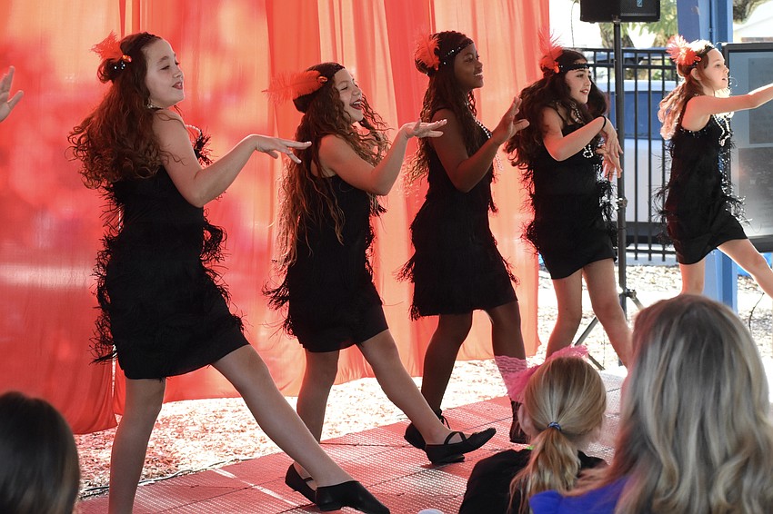 Fifth graders Payton Guerin, Eva Portnow-Rivas, Ma’laya Harris, Sienna Ackerman and Adrianna Scott perform the Charleston, celebration of the 1930s.