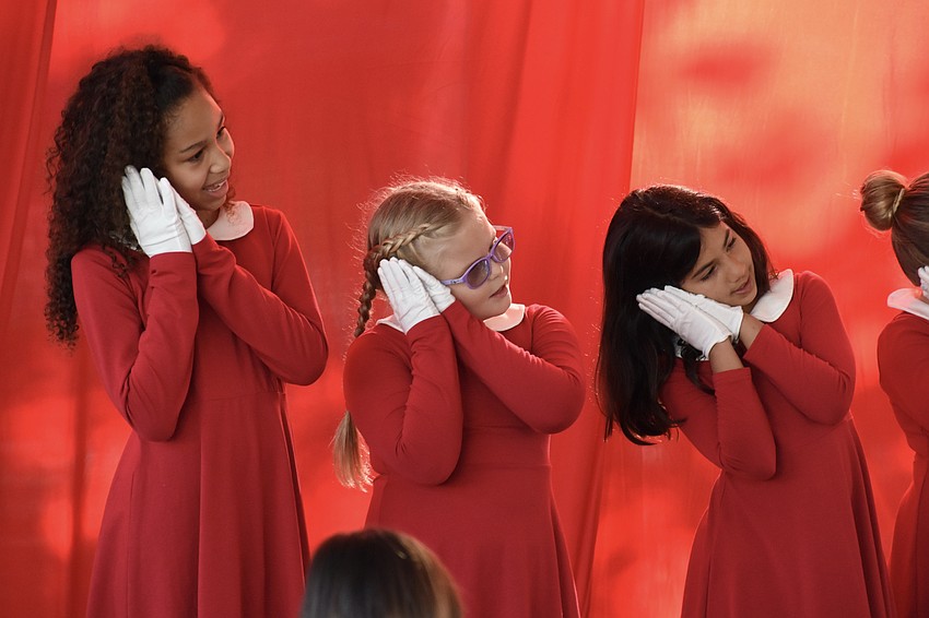 Fifth grader Nadia Abdur-Rahman, third grader Sasha Reus and third grader Arianna Shaha perform in 