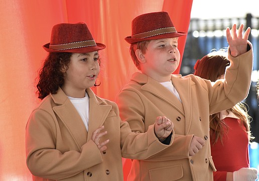 Third graders Silas Swor and Misha Reus perform in "Button Up Your Overcoat," celebrating the 1930s.