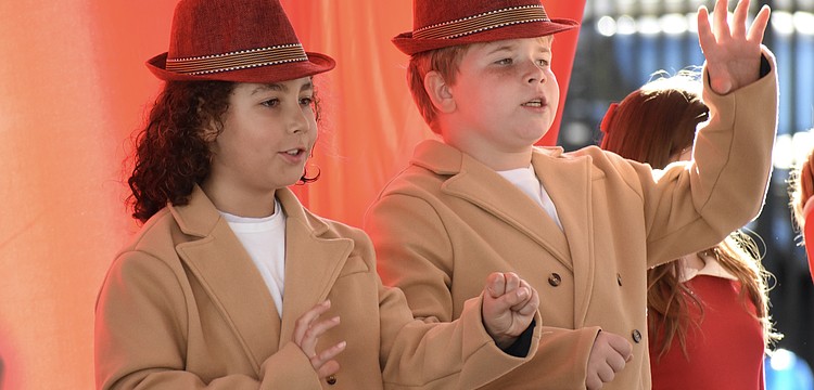 Third graders Silas Swor and Misha Reus perform in "Button Up Your Overcoat," celebrating the 1930s.