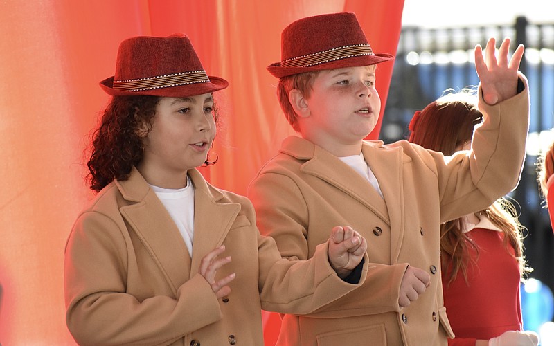 Third graders Silas Swor and Misha Reus perform in "Button Up Your Overcoat," celebrating the 1930s.